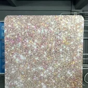Standaardachtergrond AG05 met glinsterende goud- en rosétinten.